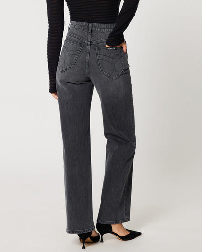 High rise worn black Heidi Jean from Rolla's. Paide with a mesh see-through long sleeve black top an black pumps.
