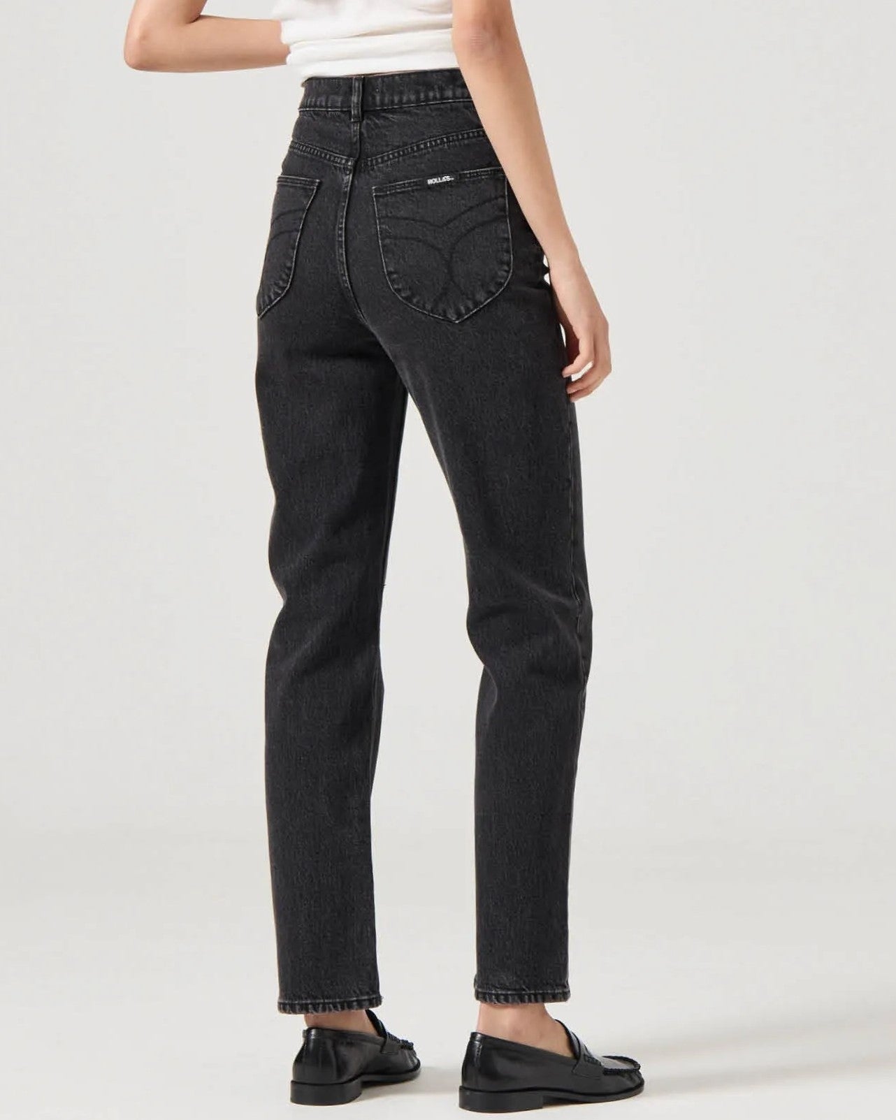 Rolla's Loulou straight jeans in black sand vintage paired with a white tank and black leather loafers