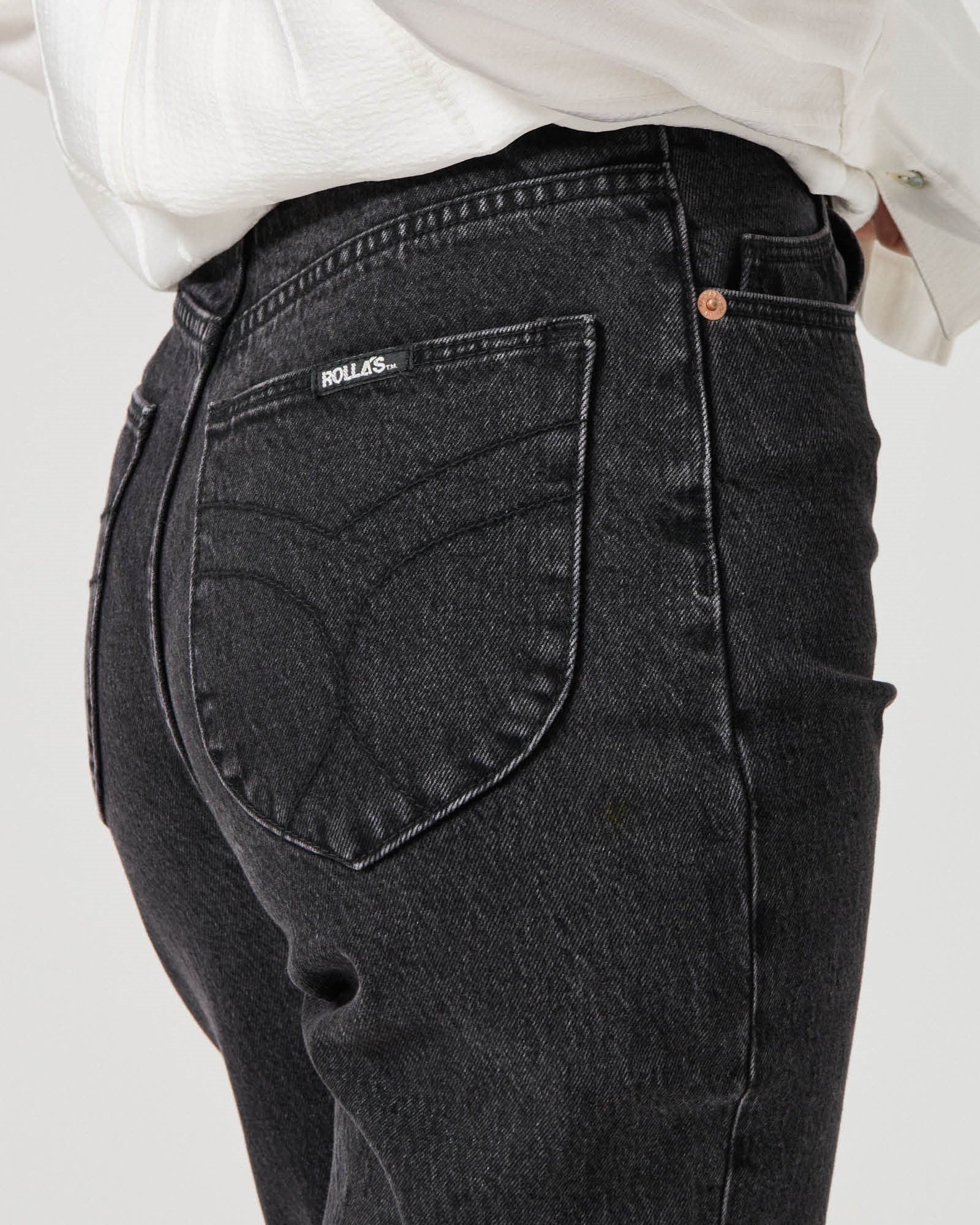 Rolla's Loulou straight jeans in black sand vintage paired with a white tank and black leather loafers
