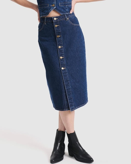 High-wasited denim skirt with button-down front by Rolla's. Paired with a matching denim vest and black ankle boots.