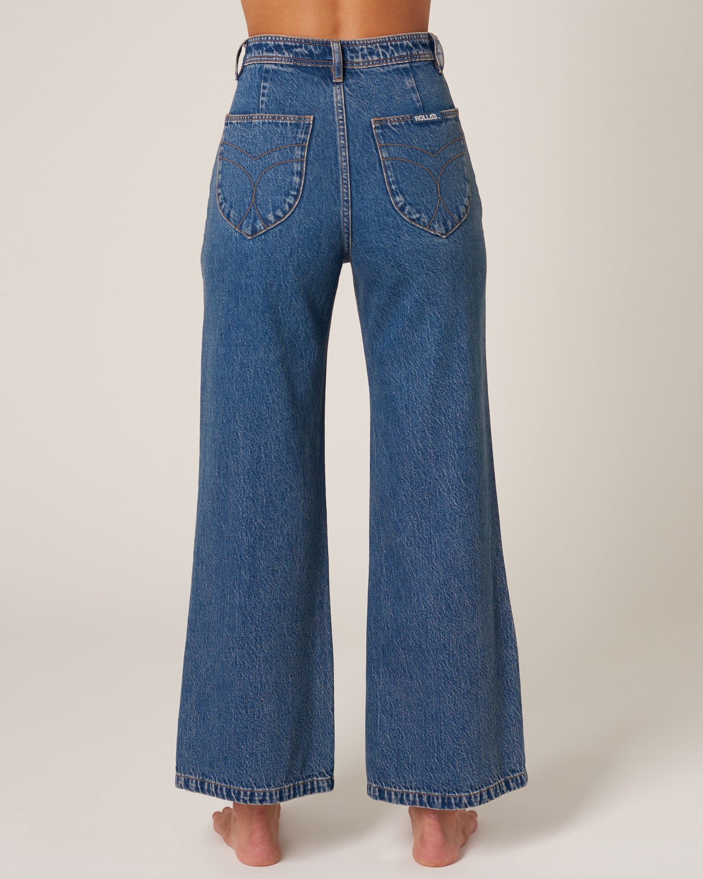 High-waisted wide leg denim blue jeans in a sailor style.