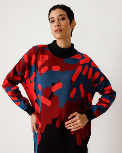 Haira sweater dress with blue, orange, red, and black from SKFK.