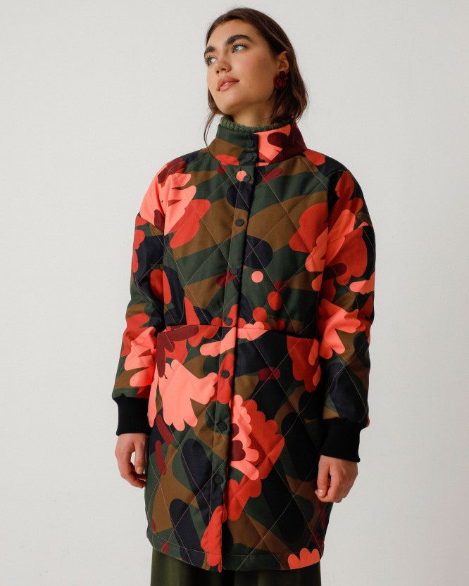 Abstract floral camo button-down jacket coat by SKFK. High mock neck collar and rib cuff sleeves.