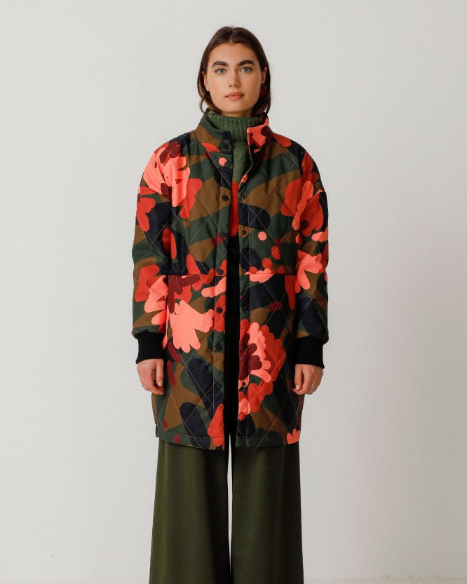 Abstract floral camo button-down jacket coat by SKFK. High mock neck collar and rib cuff sleeves.