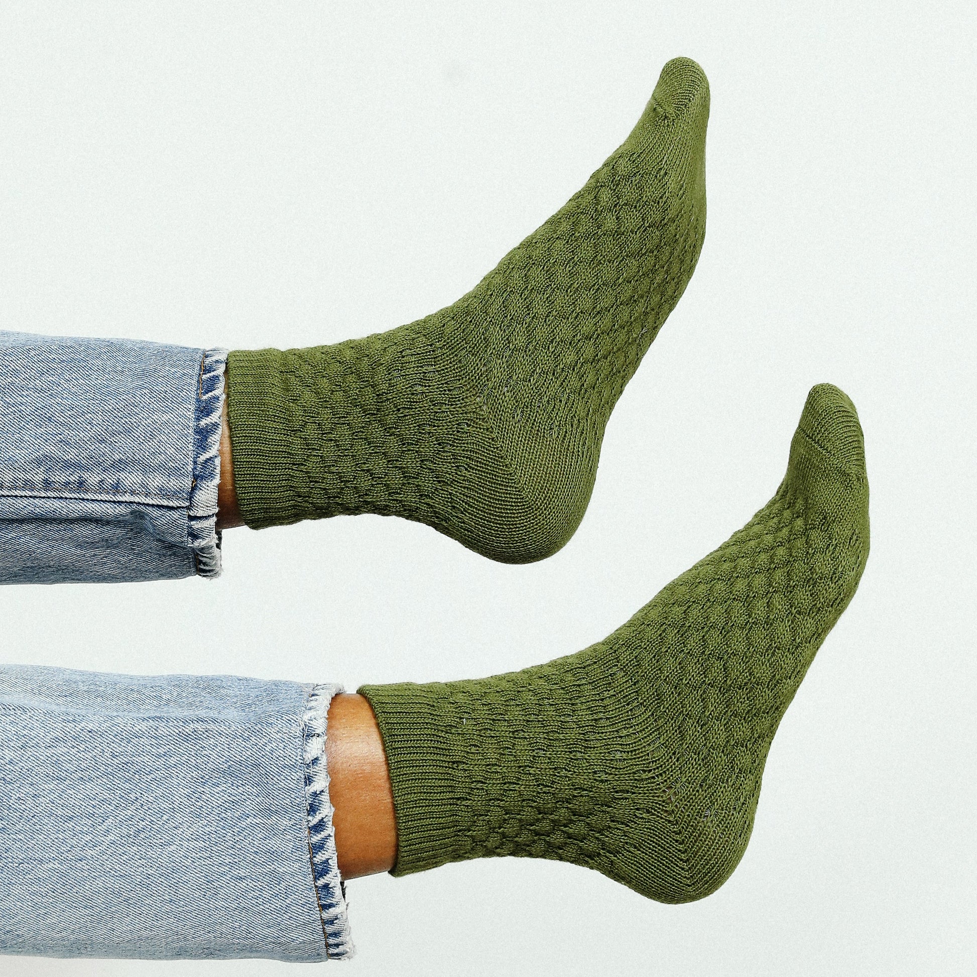 Knit sweater-like ankle socks in a moss olive green.