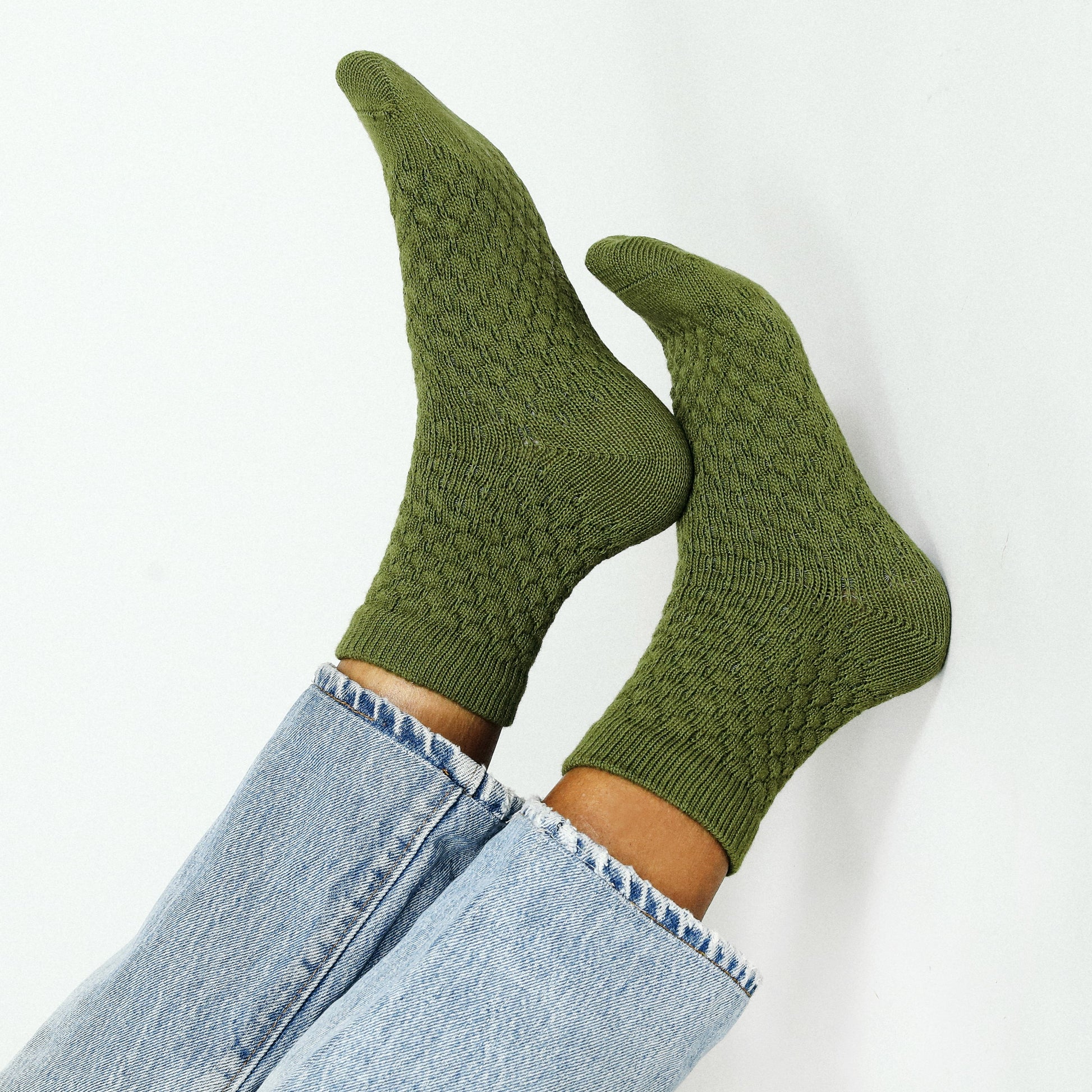 Knit sweater-like ankle socks in a moss olive green.