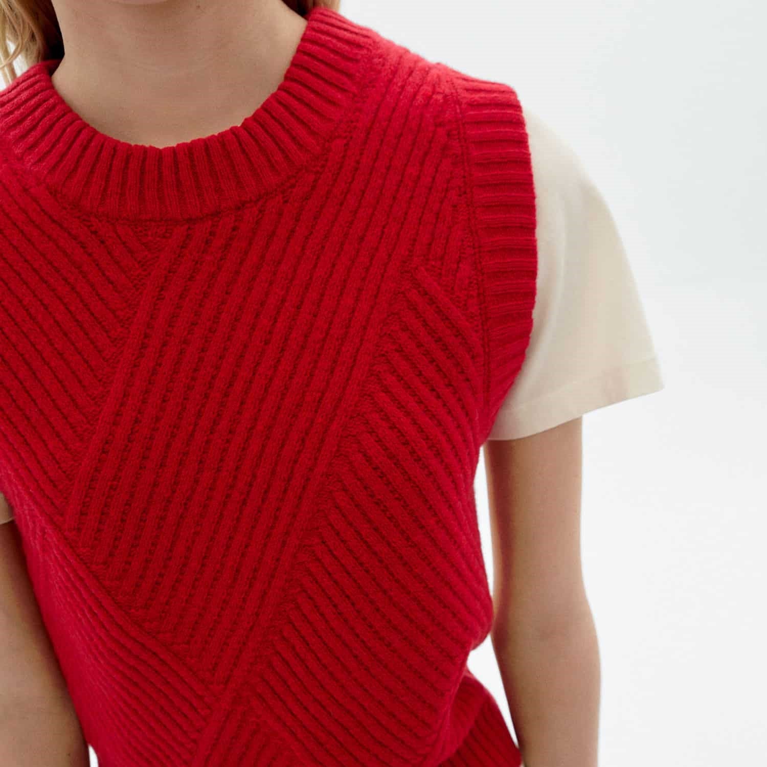 Red knit Kaia sweater vest from Thinking Mu