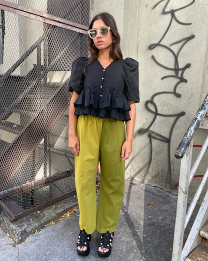 Colorblock lime green pants from Verity & Daughters with contrasting back pockets and an elastic waist at Clad, a sustainable clothing boutique in Asheville, NC