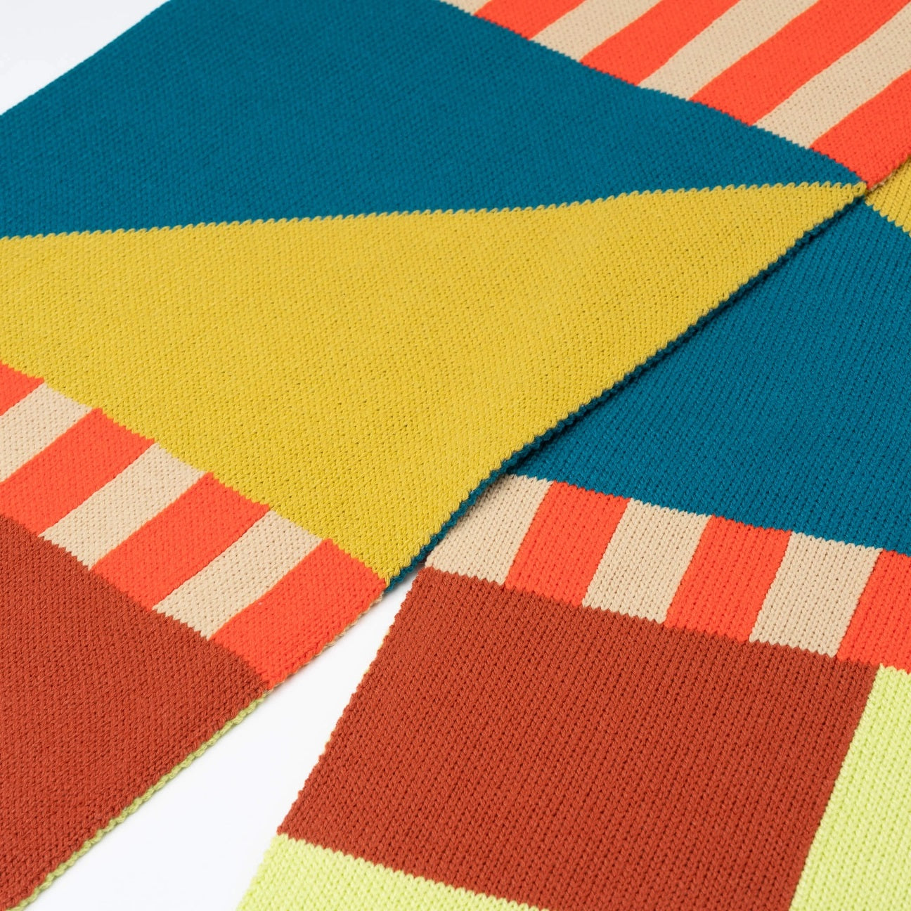 Verloop rust and lime knit kite scarf at Clad, a sustainable slow fashion clothing boutique in Asheville, NC