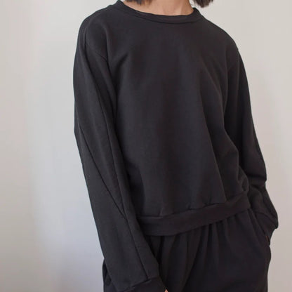 The Easy Summer Sweatshirt from sustainable brand Wol Hide in cotton with lightweight French terry. Wide hem, crew neck, black hue.