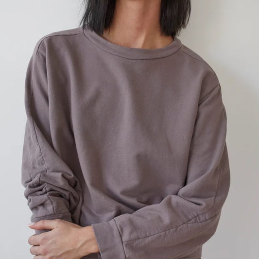 The Easy Summer Sweatshirt from sustainable brand Wol Hide in cotton with lightweight French terry. Wide hem, crew neck, mushroom light brown taupe hue.