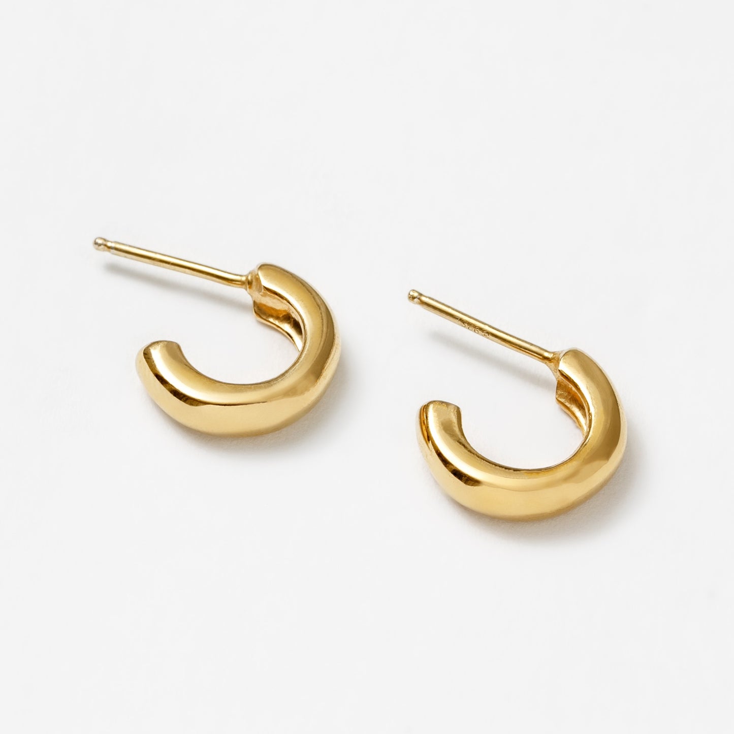 Gold-plated small everyday hoops by Wolf Circus.