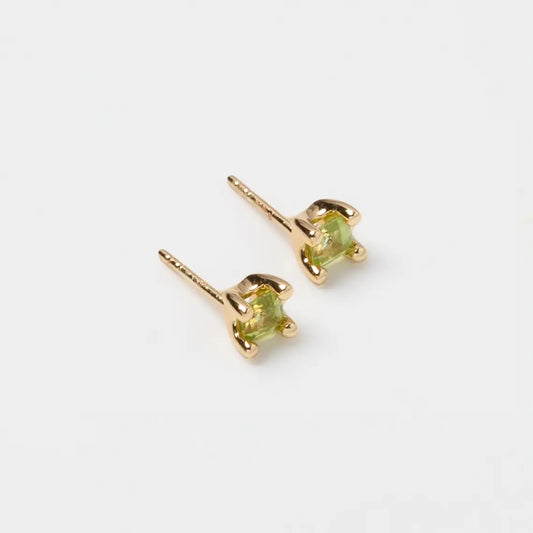 Wolf Circus green peridot gemstone stud earrings at Clad, a sustainable clothing store in Asheville, NC